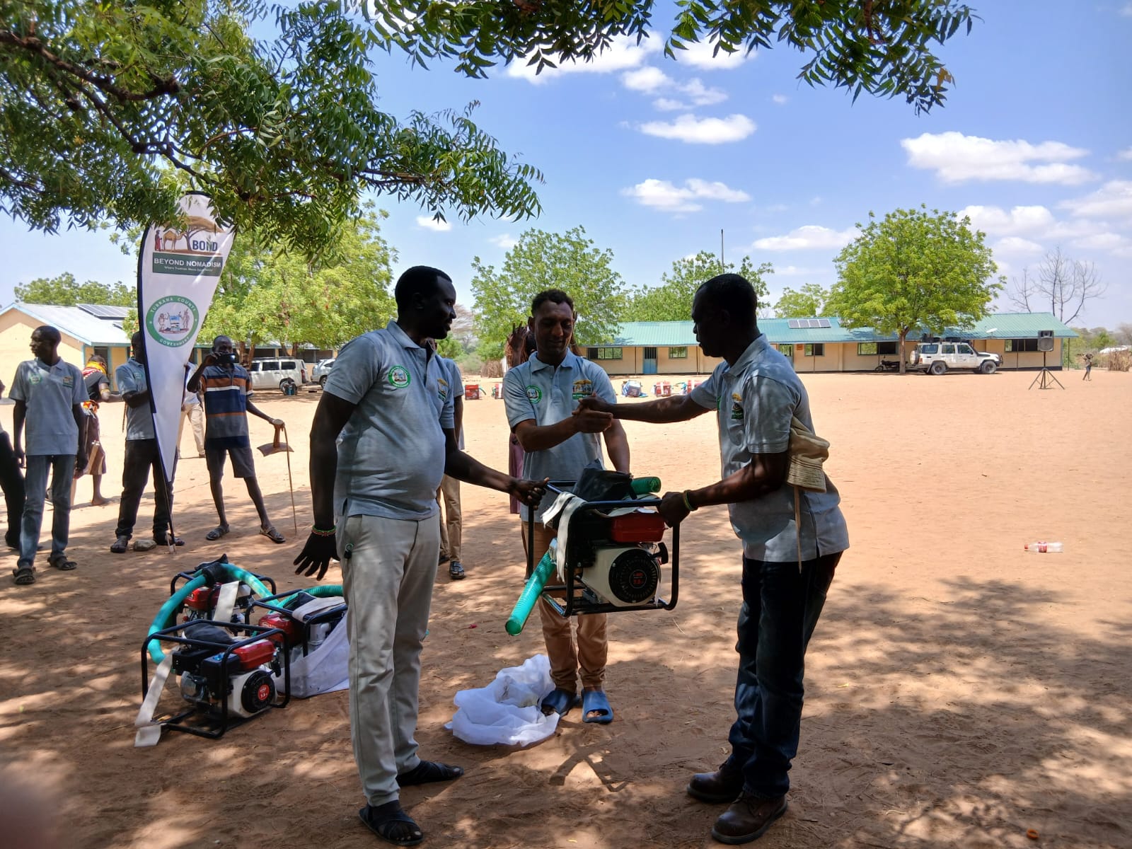 Deputy Director for Agriculture handing over water pumping generator