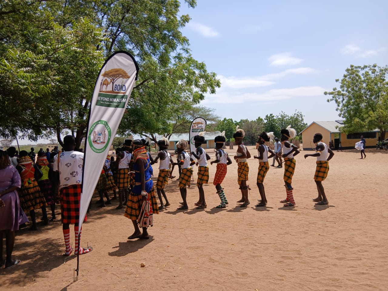 Traditional dancers performing during distribution